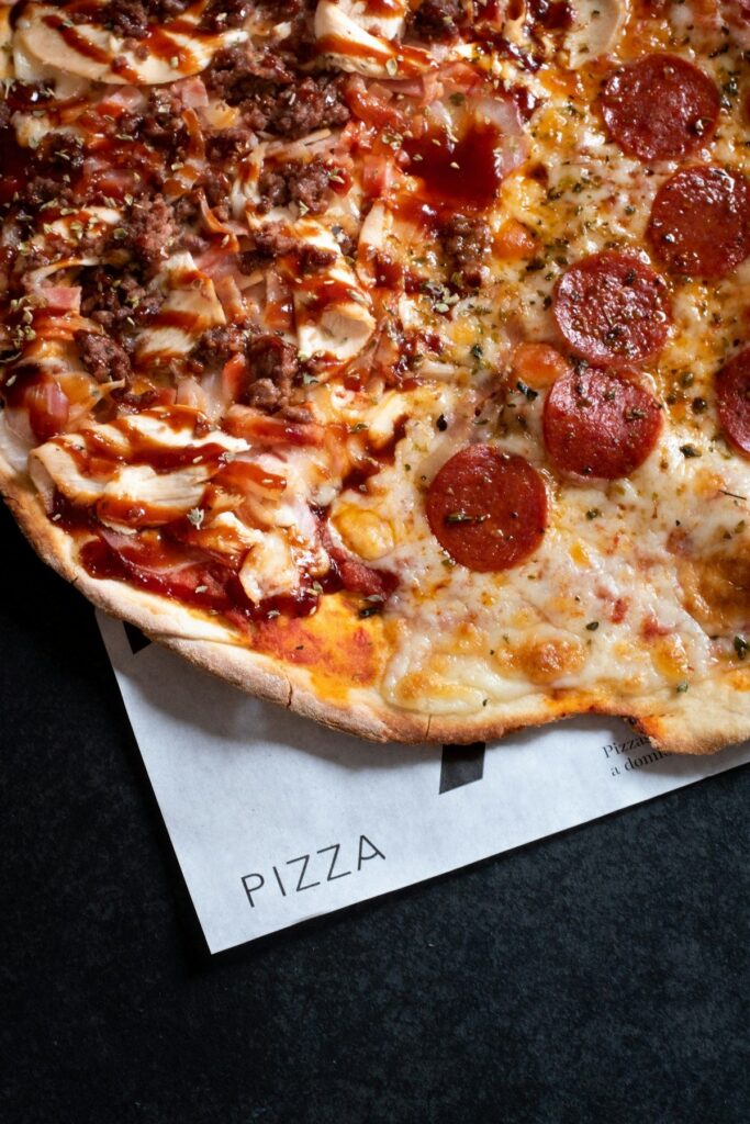 Menu Pizza Salami from the stone oven on baking paper