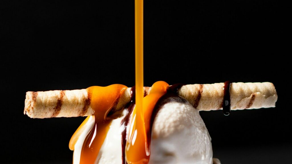 Menu Dessert with vanilla ice cream, wafer rolls and caramel sauce